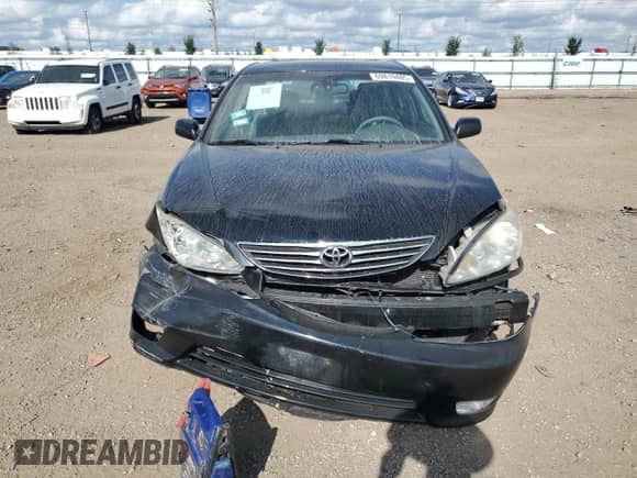 2005 Toyota Camry LE z VIN 4T1BE30K25U037477, wystawiony jako Copart lot #69819485 z przebiegiem 105 838 mil mil oraz Szkoda całkowita • Salvage title. Historia ofert i sprzedaży dostępna na DreamBid. Obrazek 5.