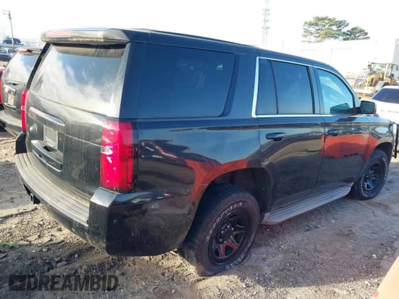 2015 Chevrolet Tahoe Commercial with VIN 1GNLC2EC4FR535329, listed as a IAAI auction lot 41643486 with 185,326 mi miles and . Bid and sale history available at DreamBid. Image 4.
