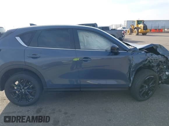 2025 Mazda CX-5 S Carbon Edition z VIN JM3KFBCM3S0689995, wystawiony jako IAAI lot #42922834 z przebiegiem 2 087 mil mil oraz . Historia ofert i sprzedaży dostępna na DreamBid. Obrazek 14.