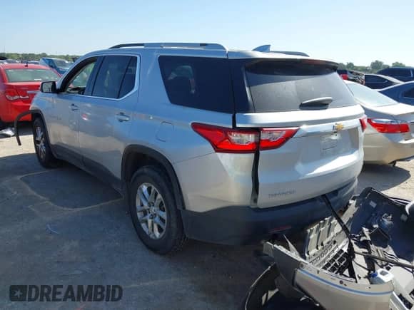 2018 Chevrolet Traverse LT Cloth z VIN 1GNERGKW0JJ153194, wystawiony jako IAAI lot #42827481 z przebiegiem 124 559 mil mil oraz . Historia ofert i sprzedaży dostępna na DreamBid. Obrazek 3.