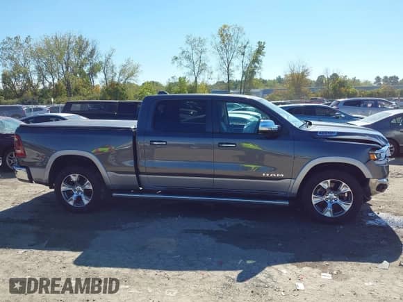 2020 Ram 1500 Laramie with VIN 1C6SRFRT7LN344695, listed as a IAAI auction lot 43316492 with 57,326 mi miles and . Bid and sale history available at DreamBid. Image 13.