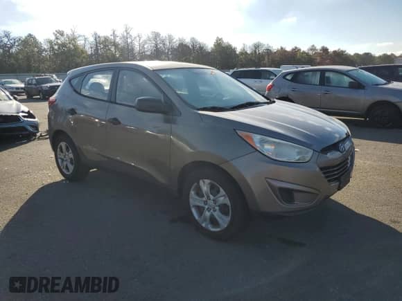 2011 Hyundai Tucson GL with VIN KM8JT3AB1BU215939, listed as a Copart auction lot 85272455 with 163,546 mi miles and Salvage title. Bid and sale history available at DreamBid. Image 4.
