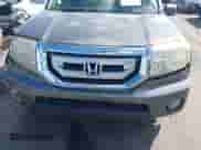 2009 Honda Pilot EX with VIN 5FNYF48479B002617, listed as a IAAI auction lot 43387010 with 216,517 mi miles and . Bid and sale history available at DreamBid. Image 14.