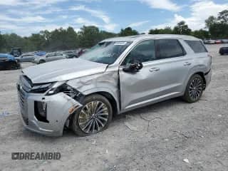 2025 Hyundai Palisade Calligraphy с VIN KM8R7DGE0SU865652, выставлен на аукционе Copart как лот 66924325 с пробегом 5 643 миль миль и Списание • Salvage title. История ставок и продаж доступна на DreamBid. Изображение 1.