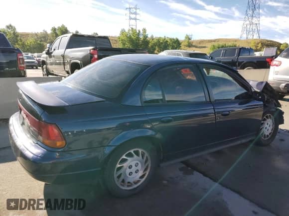 1999 Saturn SL with VIN 1G8ZJ5272XZ141986, listed as a Copart auction lot 71496674 with Not provided miles and Salvage title. Bid and sale history available at DreamBid. Image 3.