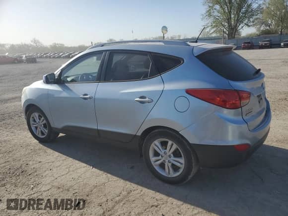 2011 Hyundai Tucson Limited with VIN KM8JU3AC7BU213263, listed as a Copart auction lot 52646455 with 165,236 mi miles and Salvage title. Bid and sale history available at DreamBid. Image 2.