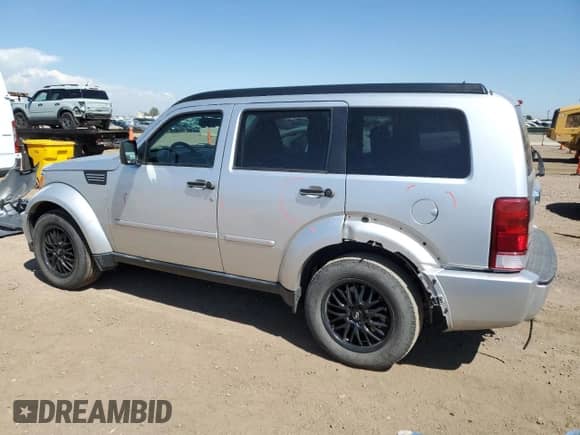 2007 Dodge Nitro SLT with VIN 1D8GU58K67W639577, listed as a Copart auction lot 68736095 with 175,807 mi miles and Salvage title. Bid and sale history available at DreamBid. Image 2.