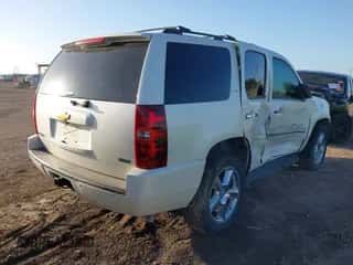 2012 Chevrolet Tahoe LTZ with VIN 1GNSCCE06CR212757, listed as a IAAI auction lot 43103185 with 180,023 mi miles and . Bid and sale history available at DreamBid. Image 4.