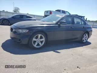 2013 BMW 3 Series 320i with VIN WBA3B1C56DK129341, listed as a Copart auction lot 71115095 with 197,405 mi miles and Salvage title. Bid and sale history available at DreamBid. Image 1.