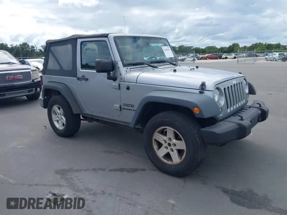 2016 Jeep Wrangler Willys Wheeler z VIN 1C4AJWAG1GL327242, wystawiony jako IAAI lot #43405493 z przebiegiem Nie podano mil oraz . Historia ofert i sprzedaży dostępna na DreamBid. Obrazek 1.