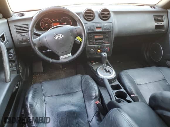 2003 Hyundai Tiburon GT с VIN KMHHN65F63U060104, выставлен на аукционе Copart как лот 84560184 с пробегом 160 120 миль миль и Чистый • Clean title. История ставок и продаж доступна на DreamBid. Изображение 8.