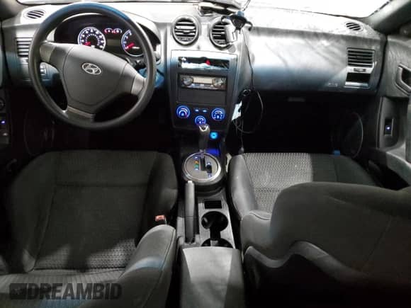 2008 Hyundai Tiburon GS with VIN KMHHM66D48U265282, listed as a Copart auction lot 77391204 with 77,088 mi miles and Salvage title. Bid and sale history available at DreamBid. Image 8.