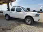 2001 Nissan Frontier SE with VIN 1N6ED27T91C344946, listed as a Copart auction lot 57488105 with 183,127 mi miles and Salvage title. Bid and sale history available at DreamBid. Image 4.