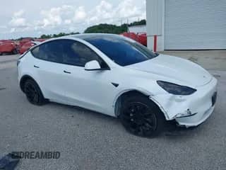 2022 Tesla Model Y Long Range z VIN 7SAYGDEE1NF385915, wystawiony jako IAAI lot #42458295 z przebiegiem 68 345 mil mil oraz . Historia ofert i sprzedaży dostępna na DreamBid. Obrazek 1.