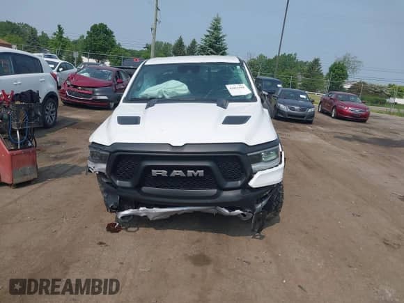 2022 Ram 1500 Rebel z VIN 1C6SRFLT5NN318494, wystawiony jako IAAI lot #42413194 z przebiegiem 59 458 mil mil oraz . Historia ofert i sprzedaży dostępna na DreamBid. Obrazek 12.