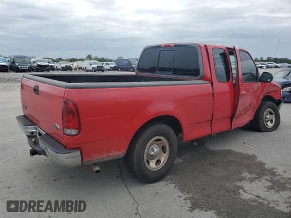 2003 Ford F-150 XL with VIN 1FTRX17223NA54973, listed as a Copart auction lot 84985985 with 239,967 mi miles and Salvage title. Bid and sale history available at DreamBid. Image 3.