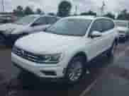 2019 Volkswagen Tiguan S with VIN 3VV1B7AXXKM087166, listed as a IAAI auction lot 42672005 with 68,269 mi miles and . Bid and sale history available at DreamBid. Image 2.