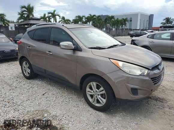 2012 Hyundai Tucson GLS z VIN KM8JU3AC6CU488866, wystawiony jako Copart lot #83814925 z przebiegiem 148 750 mil mil oraz Szkoda całkowita • Salvage title. Historia ofert i sprzedaży dostępna na DreamBid. Obrazek 4.