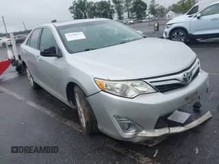 2013 Toyota Camry XLE with VIN 4T1BK1FK2DU527436, listed as a IAAI auction lot 43310672 with 158,921 mi miles and . Bid and sale history available at DreamBid. Image 1.