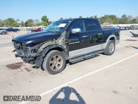 2012 Ram 1500 Laramie with VIN 1C6RD7NT5CS306229, listed as a IAAI auction lot 43373111 with 227,543 mi miles and . Bid and sale history available at DreamBid. Image 2.