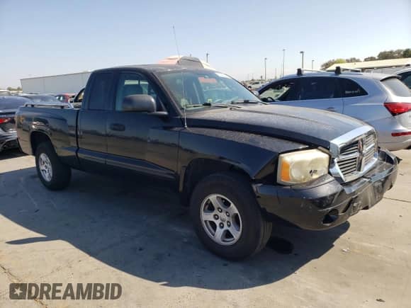 2005 Dodge Dakota SLT с VIN 1D7HE42N65S163225, выставлен на аукционе Copart как лот 80413475 с пробегом 137 282 миль миль и Списание • Salvage title. История ставок и продаж доступна на DreamBid. Изображение 4.