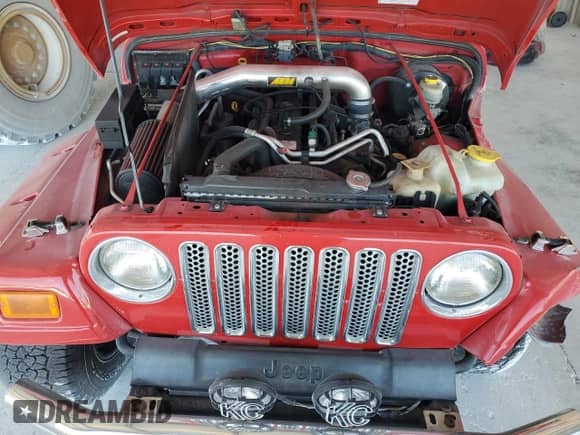 2005 Jeep Wrangler X z VIN 1J4FA39S85P388732, wystawiony jako Copart lot #68840685 z przebiegiem 233 280 mil mil oraz Nie do naprawy • Non repairable. Historia ofert i sprzedaży dostępna na DreamBid. Obrazek 11.