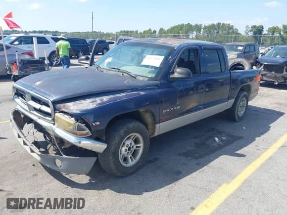 2000 Dodge Dakota Sport with VIN 1B7GL2AX8YS783520, listed as a IAAI auction lot 43277615 with 303,682 mi miles and . Bid and sale history available at DreamBid. Image 2.