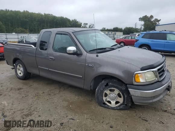 2002 Ford F-150 XL with VIN 2FTRX17262CA17400, listed as a Copart auction lot 86613415 with 96,852 mi miles and Salvage title. Bid and sale history available at DreamBid. Image 4.