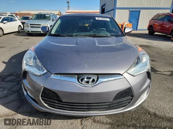 2013 Hyundai Veloster w/Gray Int z VIN KMHTC6AD9DU150403, wystawiony jako Copart lot #82136875 z przebiegiem 122 481 mil mil oraz Szkoda całkowita • Salvage title. Historia ofert i sprzedaży dostępna na DreamBid. Obrazek 5.