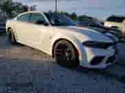 2023 Dodge Charger SRT Hellcat Redeye Widebody with VIN 2C3CDXL92PH630519, listed as a Copart auction lot 83360544 with 12,389 mi miles and Salvage title. Bid and sale history available at DreamBid. Image 4.