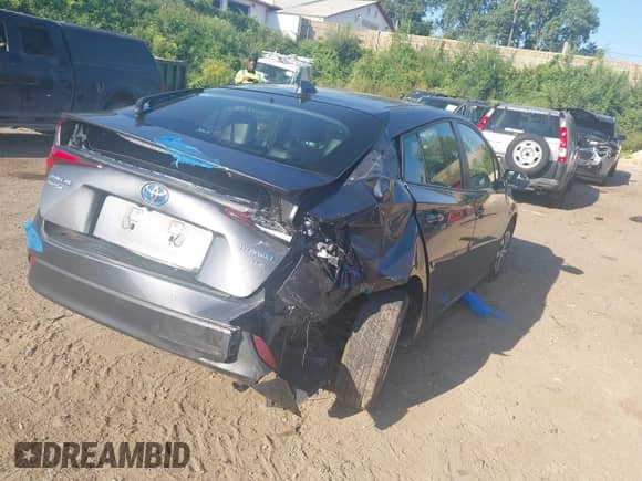 2021 Toyota Prius LE with VIN JTDL9MFU8M3028928, listed as a IAAI auction lot 43099318 with 72,833 mi miles and . Bid and sale history available at DreamBid. Image 4.