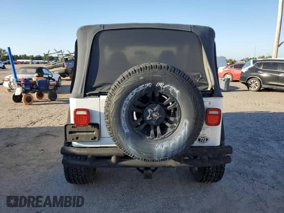 1999 Jeep Wrangler Sport with VIN 1J4FY19SXXP412760, listed as a Copart auction lot 84983895 with 180,172 mi miles and Clean title. Bid and sale history available at DreamBid. Image 6.