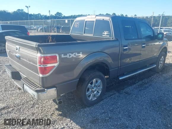 2013 Ford F-150 Lariat with VIN 1FTFW1ET5DKE51436, listed as a IAAI auction lot 43459885 with 149,455 mi miles and . Bid and sale history available at DreamBid. Image 4.