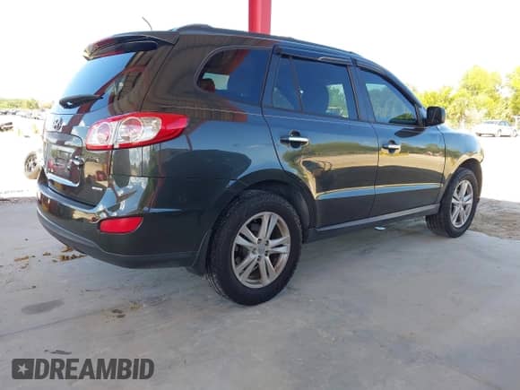 2012 Hyundai Santa Fe Limited z VIN 5XYZK4AG5CG147997, wystawiony jako IAAI lot #43474178 z przebiegiem 172 339 mil mil oraz . Historia ofert i sprzedaży dostępna na DreamBid. Obrazek 4.