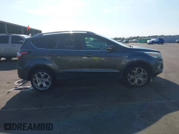 2017 Ford Escape Titanium with VIN 1FMCU0J92HUE56774, listed as a IAAI auction lot 43255074 with 107,556 mi miles and . Bid and sale history available at DreamBid. Image 14.