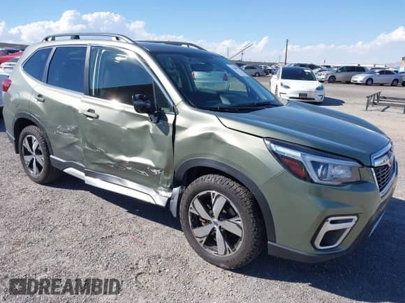 2020 Subaru Forester Touring with VIN JF2SKAXCXLH545932, listed as a IAAI auction lot 43305973 with 50,723 mi miles and . Bid and sale history available at DreamBid. Image 1.