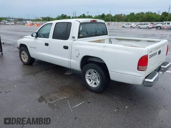 2001 Dodge Dakota Sport with VIN 1B7GL2AN81S102874, listed as a IAAI auction lot 43001313 with 158,635 mi miles and . Bid and sale history available at DreamBid. Image 3.