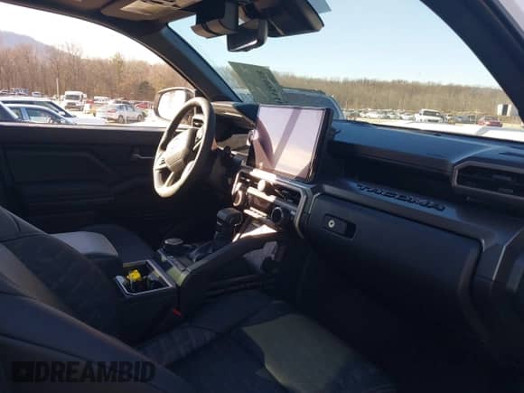 2024 Toyota Tacoma SR5 with VIN 3TMLB5JN1RM022825, listed as a IAAI auction lot 41356038 with 3,977 mi miles and . Bid and sale history available at DreamBid. Image 5.
