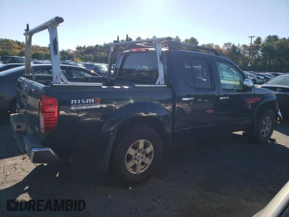 2006 Nissan Frontier SE with VIN 1N6AD07W86C401240, listed as a Copart auction lot 87023625 with 252,639 mi miles and Salvage title. Bid and sale history available at DreamBid. Image 3.