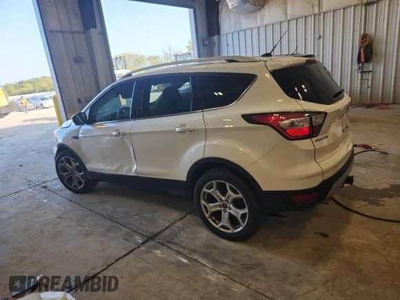 2017 Ford Escape Titanium с VIN 1FMCU9J90HUA46981, выставлен на аукционе Copart как лот 81252645 с пробегом 98 545 миль миль и На запчасти • Non repairable. История ставок и продаж доступна на DreamBid. Изображение 2.