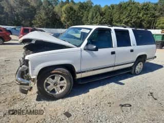 1999 Chevrolet Suburban with VIN 3GNFK16R5XG149629, listed as a Copart auction lot 90065225 with 404,104 mi miles and Salvage title. Bid and sale history available at DreamBid. Image 1.