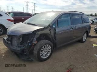 2012 Toyota Sienna XLE AAS with VIN 5TDYK3DC8CS279265, listed as a Copart auction lot 82003505 with Not provided miles and Salvage title. Bid and sale history available at DreamBid. Image 1.