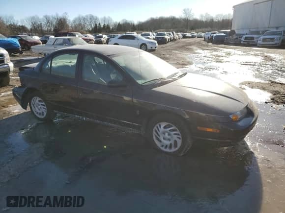 2000 Saturn SL with VIN 1G8ZH5283YZ169267, listed as a Copart auction lot 42626335 with 131,556 mi miles and Salvage title. Bid and sale history available at DreamBid. Image 4.