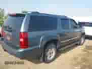 2009 Chevrolet Suburban 2LT z VIN 1GNFK263X9R140736, wystawiony jako IAAI lot #42790273 z przebiegiem 166 631 mil mil oraz . Historia ofert i sprzedaży dostępna na DreamBid. Obrazek 4.