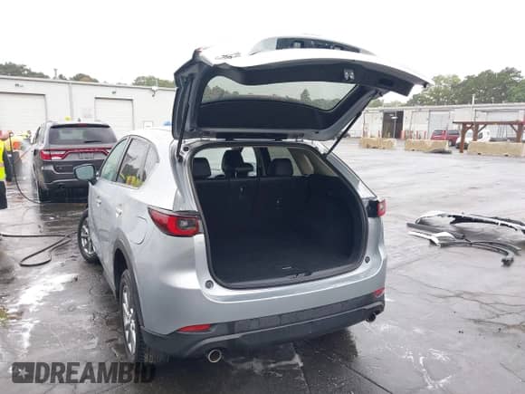 2023 Mazda CX-5 S Select with VIN JM3KFBBM4P0272667, listed as a IAAI auction lot 43014607 with 22,598 mi miles and . Bid and sale history available at DreamBid. Image 3.