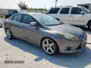 2014 Ford Focus Titanium with VIN 1FADP3J26EL149118, listed as a Copart auction lot 70688925 with 94,831 mi miles and Salvage title. Bid and sale history available at DreamBid. Image 4.