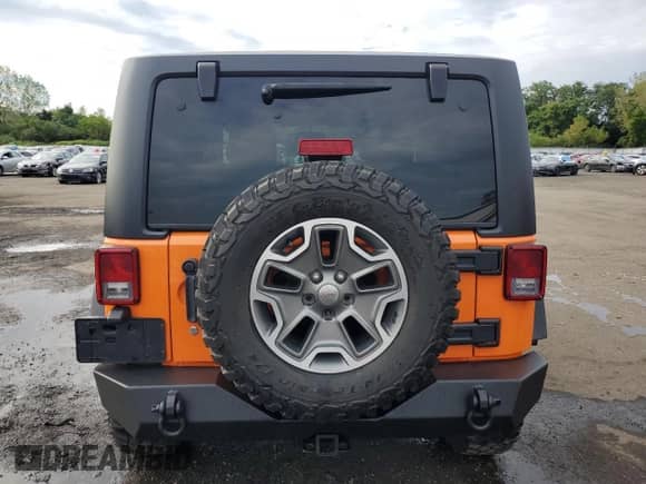 2013 Jeep Wrangler Rubicon 10th Anniversary with VIN 1C4BJWCG0DL509141, listed as a Copart auction lot 70674925 with 118,224 mi miles and Salvage title. Bid and sale history available at DreamBid. Image 6.