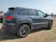 2017 Jeep Grand Cherokee Trailhawk z VIN 1C4RJFLG0HC807936, wystawiony jako Copart lot #71960485 z przebiegiem 143 040 mil mil oraz Szkoda całkowita • Salvage title. Historia ofert i sprzedaży dostępna na DreamBid. Obrazek 3.