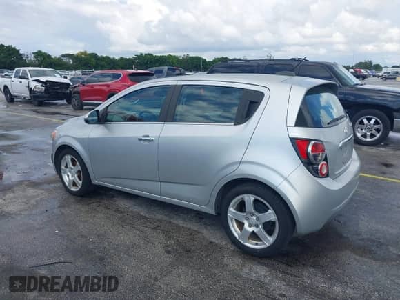 2015 Chevrolet Sonic LTZ with VIN 1G1JE6SB2F4103387, listed as a IAAI auction lot 43400010 with 74,902 mi miles and . Bid and sale history available at DreamBid. Image 3.
