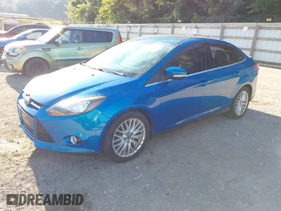 2013 Ford Focus Titanium with VIN 1FADP3J29DL129332, listed as a IAAI auction lot 43120139 with Not provided miles and . Bid and sale history available at DreamBid. Image 2.